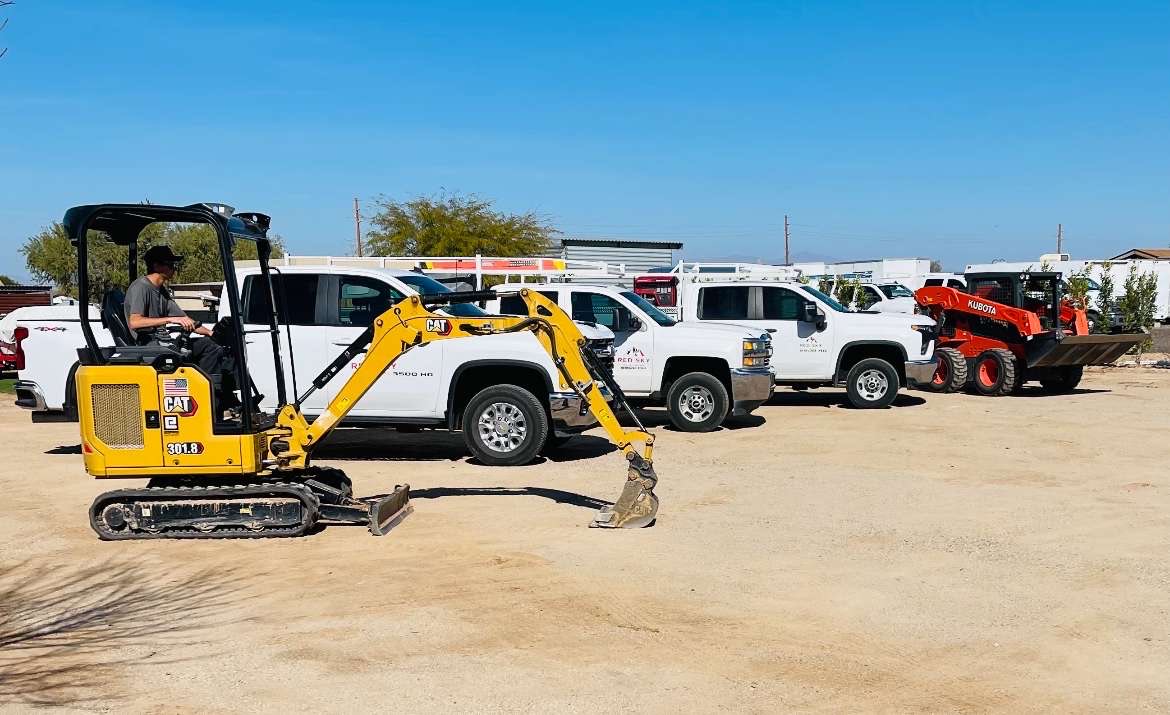 Blakey operating a mini excavator for precise digging and landscaping work