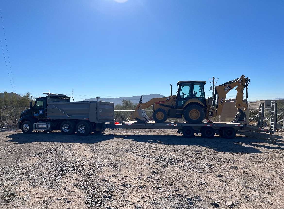 Array of construction equipment including excavators and bulldozers on a job site